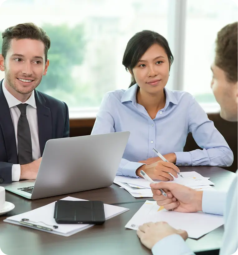 Professional insurance broker consulting with a family in an office to explain coverage options available in Ottawa