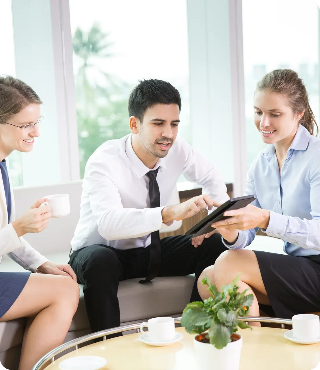 Hospitality insurance experts reviewing digital claims on a tablet to protect your hotel or restaurant business.