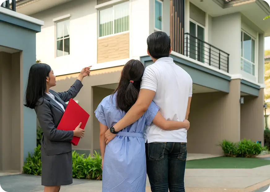 Insurance advisor showing a couple a modern rental home exterior, representing coverage guidance for rental properties and home-based businesses