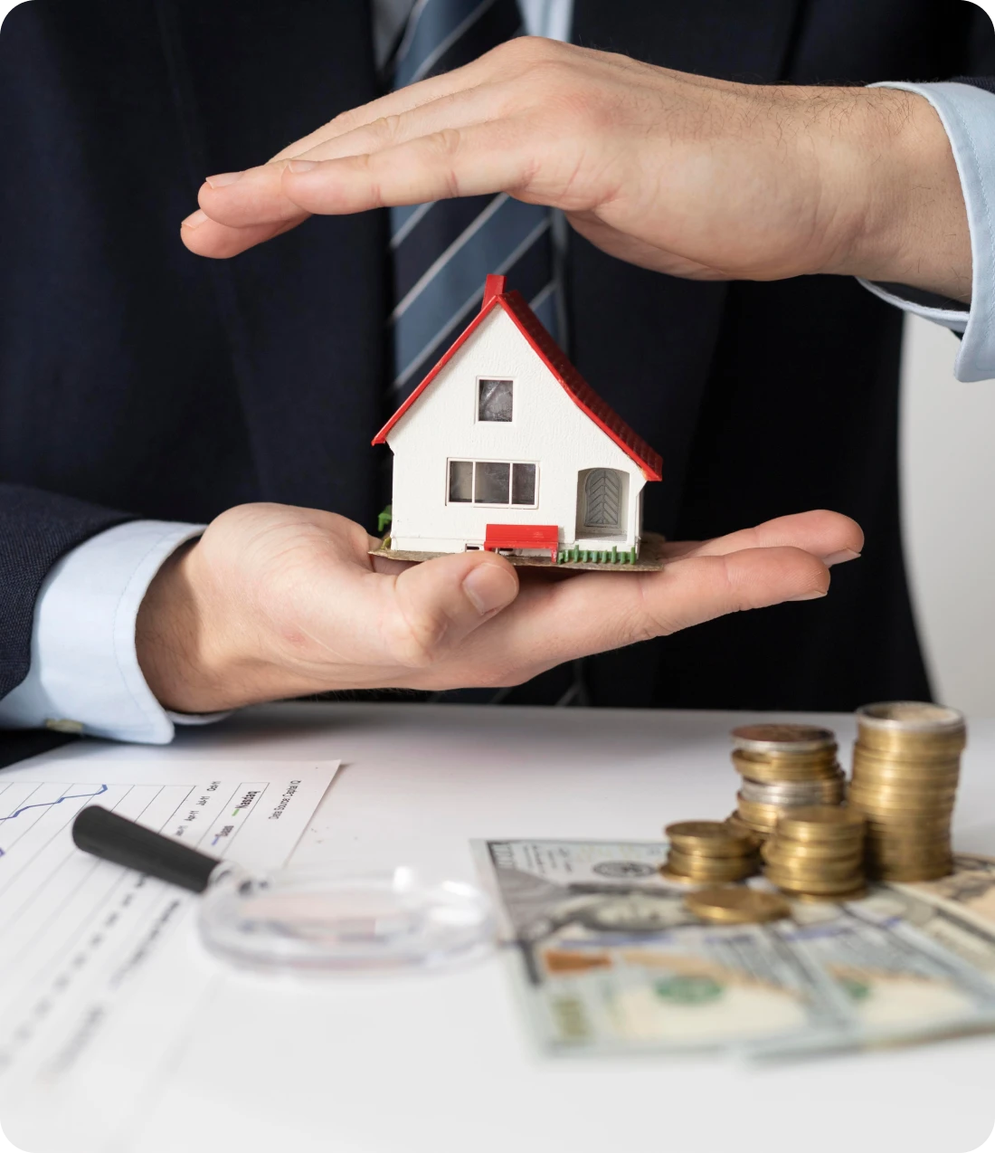 Person protecting house and holding money representing insurance protection and financial security